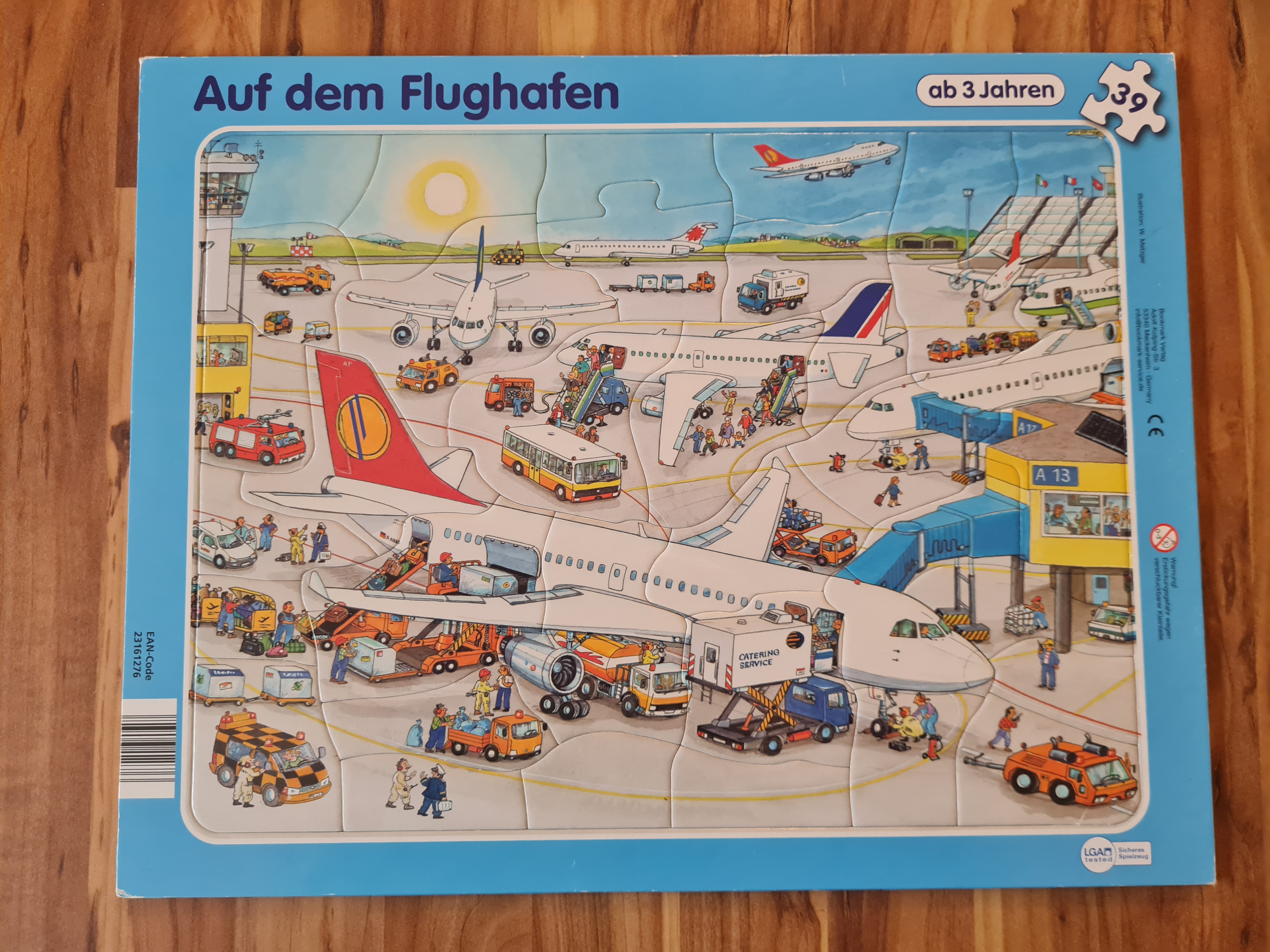 Rahmenpuzzle Auf dem Flughafen, 39 Teile